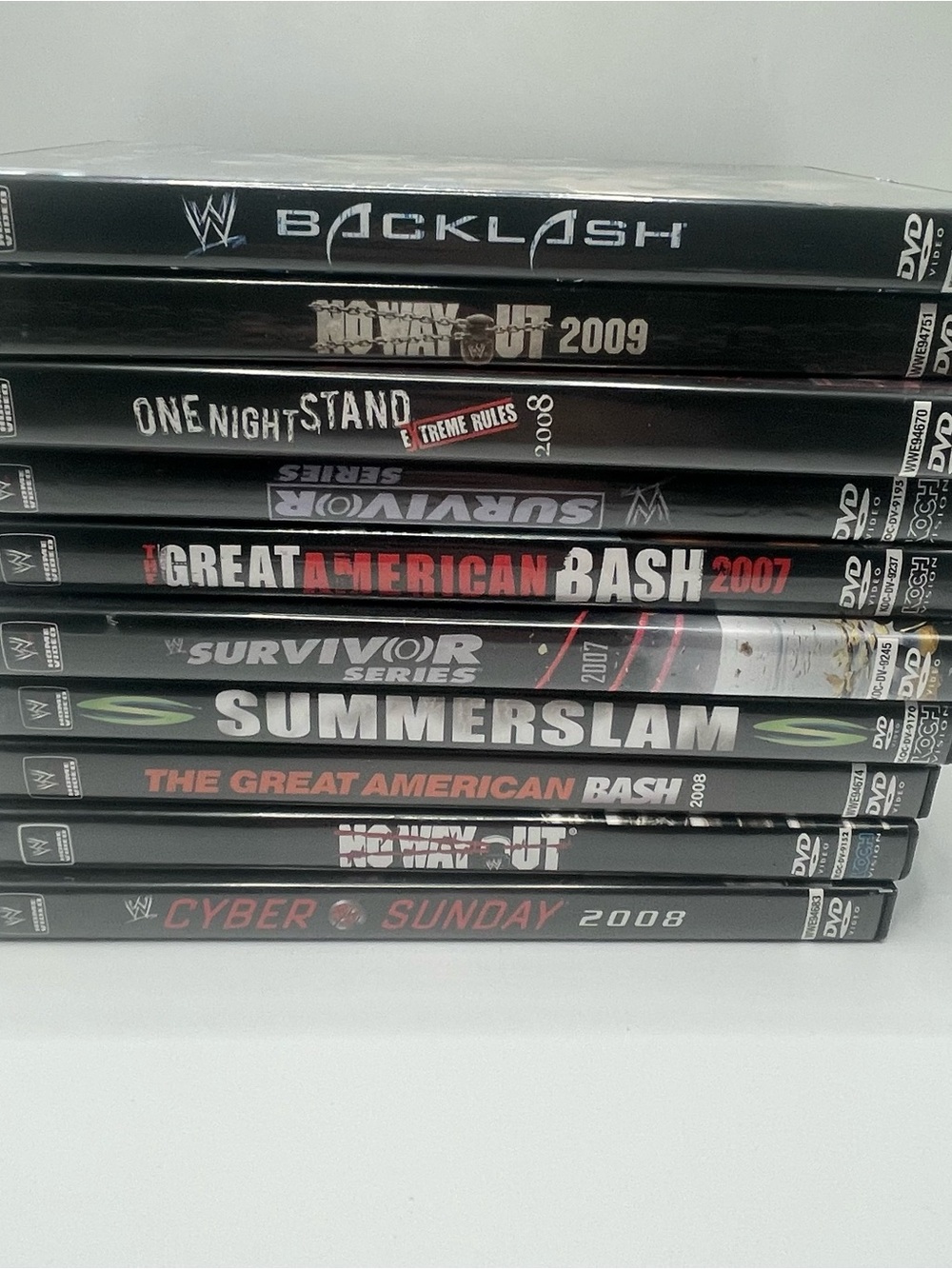 WWE DVD Pay-Per-View Stack – Black With White and Red Accents